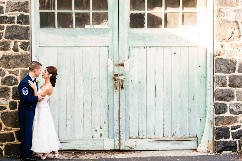 Military couple outside carriage house